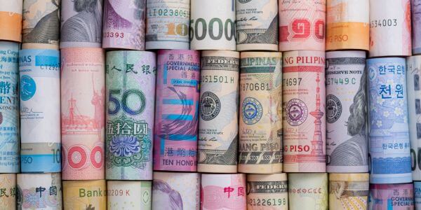 Managing multi-currency and cross-border loan disbursement